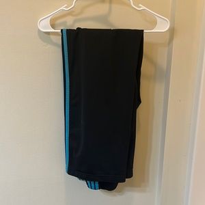 Black adidas pants with blue triple stripe
